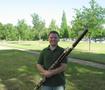 Thumbnail image of item number 1 in: '[A man in a green shirt posing with a bassoon, 2]'.