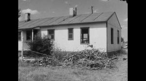 [News Clip: Wartime housing project wrecked]