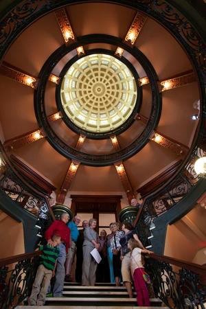 [Capturing Timeless Memories: Posing Under the Graceful Dome of Harrison County Historical Museum]