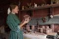Thumbnail image of item number 1 in: '[Woman admiring pottery]'.