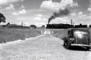[Stepping Back in Time: Vintage Car and Steam Engine Encounter]