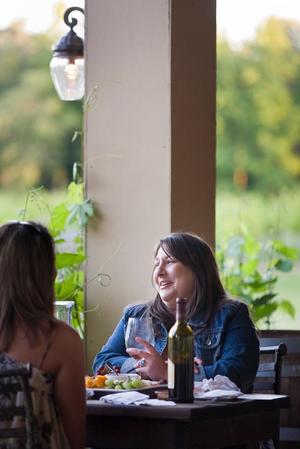 [Savoring Sisterhood: Two Friends Delight in Wine and Culinary Treasures at the Winery Restaurant]