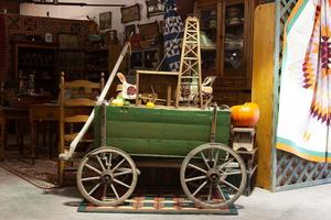 [Nostalgic Journey: Antique Wooden Carriage and Artifacts Grace Round Top Antiques Market]