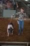 Primary view of [Woman with her pig at the East Texas State Fair]
