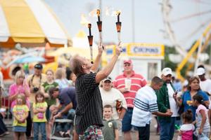 [People enjoying the juggling show at the East Texas State Fair]