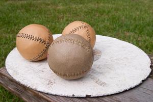 [Three baseballs]