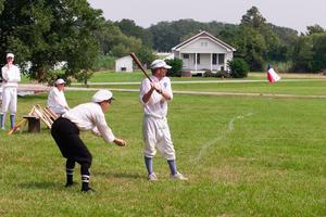 [Baseball players in vintage outfits]