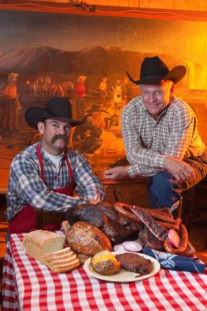 Primary view of object titled '[Cowboys with food]'.