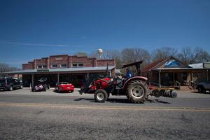 [Tractor in small town]