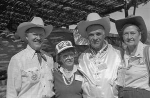 Primary view of object titled '[Four people at the Terlingua Chili Cook-Off, 1]'.
