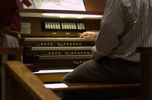 [A Man Playing the Organ]