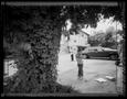 Photograph: [Two boy standing in a parking lot]