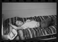 Photograph: [Boy Lying on a Bed]
