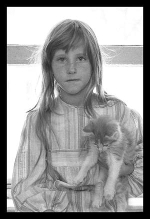 Primary view of object titled '[Crop young girl holding a kitten]'.