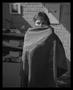 Photograph: [Woman wearing a sheet over her face]