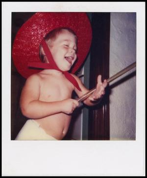 [Child in a red hat]