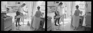[Man and woman standing in a kitchen]