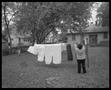Photograph: [Lady Hanging Laundry, 1987]