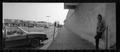 Photograph: [Jefferson Blvd Panoramic Guy Leans on Wall, 1987]