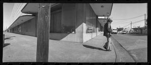 Primary view of object titled '[Panoramic Jefferson Blvd Pole and Man, 1987]'.
