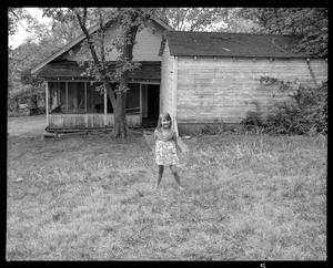 Primary view of object titled '[Little Girl Behind House 1976]'.