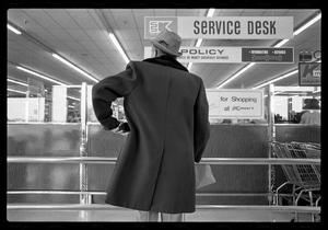 [Man at Service Desk 1977]