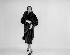 [A woman posing in a fur coat, 2]