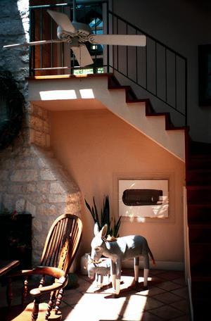 [A fireplace and staircase at Roadrunner Farm, 2]