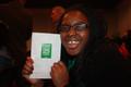 Photograph: [Smiling Student with UNT "Four Bold Goals" Pamphlet]