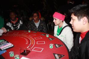 [Four UNT Students at Red Poker Table]