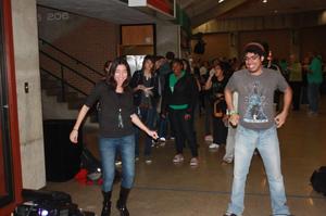 [Students Posing in UNT Coliseum Hallway]