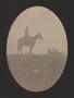 Primary view of [Photograph of a cowboy on a horse]