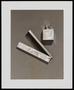 Photograph: [A travel comb laid next to a bottle]