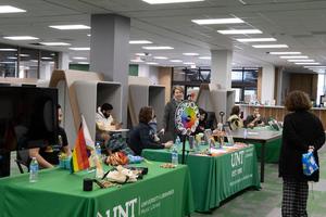 [UNT libraries setting up tables for Pride Week]