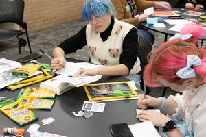 [Two students working on their personalized zines]
