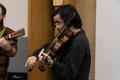 Photograph: [Viola player performing]