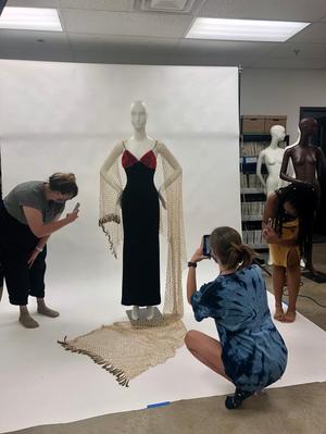 [Students photographing mannequin]