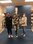 Primary view of [Megan Desoto and Janelle McCabe standing next to a mannequin]