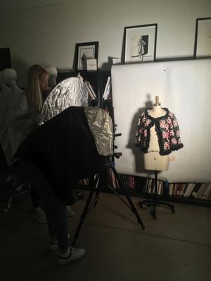 Primary view of object titled '[Students photographing a women's wrap]'.