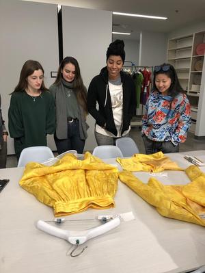 [Students examine a suit designed by Michael Faircloth, 2]