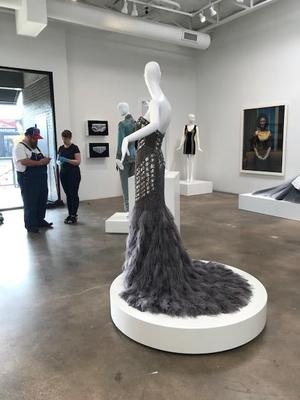 [Exhibition featuring an Escada dress]