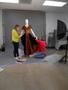 Primary view of [Annette Becker and Janelle McCabe mounting an evening dress]