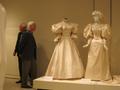 Primary view of [Winn Morton looking at historic wedding dresses]