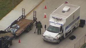 [News Clip: Aerial Insight - Dallas Police Bomb Squad Tackles Suspicious Ground Package, 2]