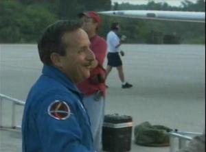 [News Clip: NASA Astronauts and Team Emerge from Iconic Plane Amidst Media Spectacle]