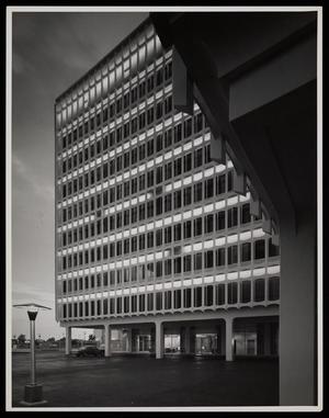 [An office building with rectangular exterior framing]
