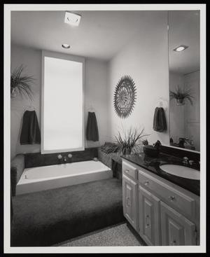 [A bathroom with a bathtub surrounded by carpeting]