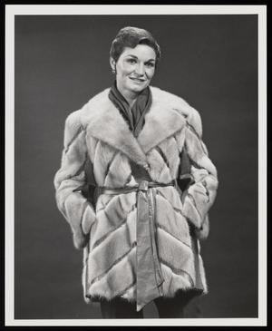 [A woman in a pale fur coat posing, 2]
