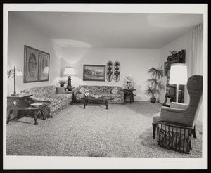 [A living room with floral-patterned couches]