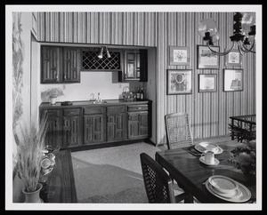 [Interior of a dining room with striped wallpaper]